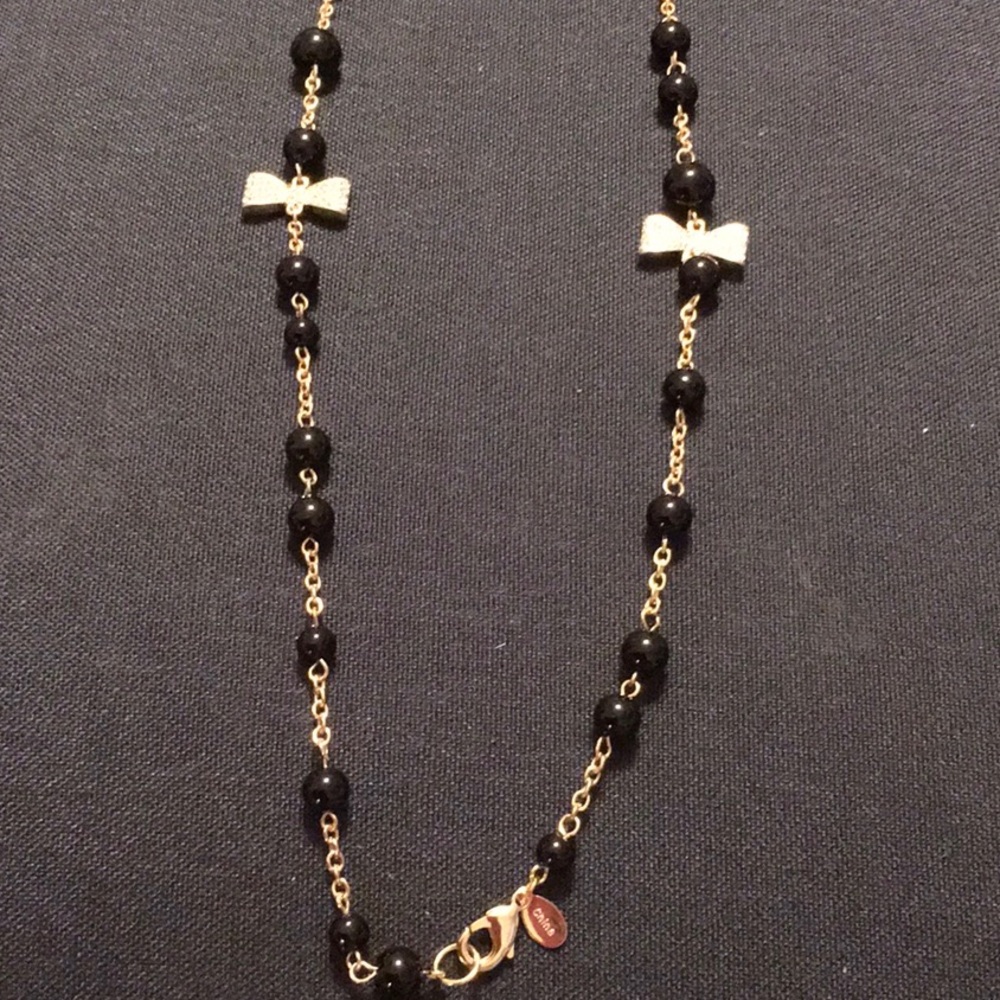 EUC, 48" necklace,onyx like graduated beads, goldtone crystal bows.Lobster claw.